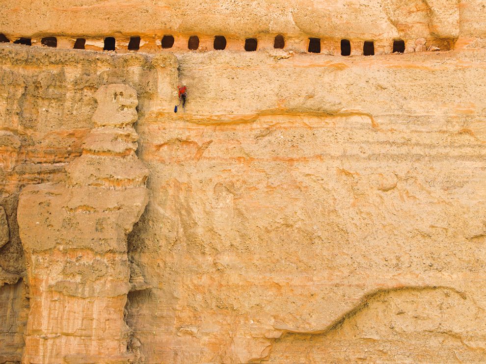 Picture of a climber scaling a rock face in Nepal