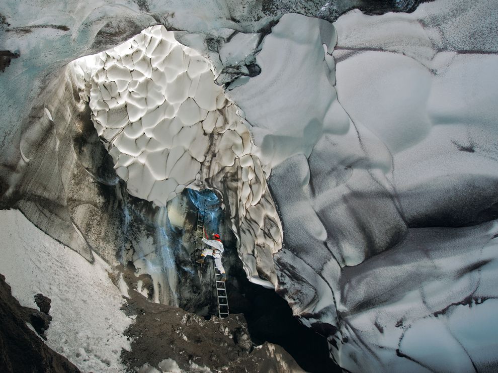 Picture of a climber in an ice cave in Antarctica