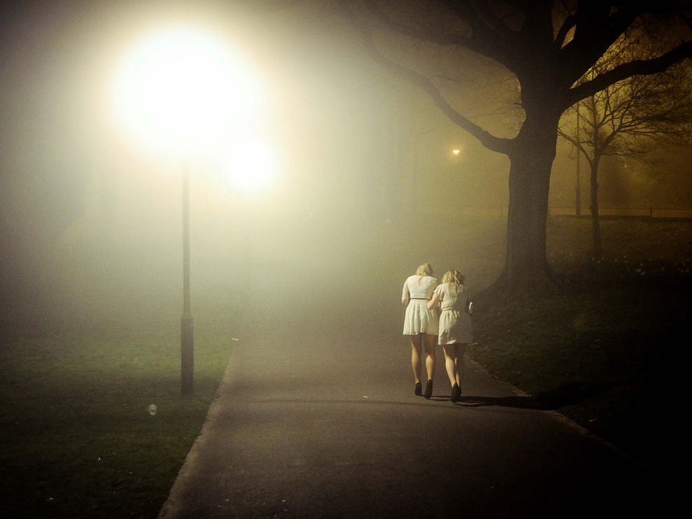 Picture of two girls walking along a path in a park in the United Kingdom