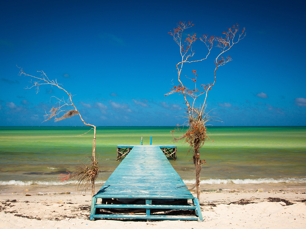 Photo: A dock stretching out into the water on the coast of Cuba