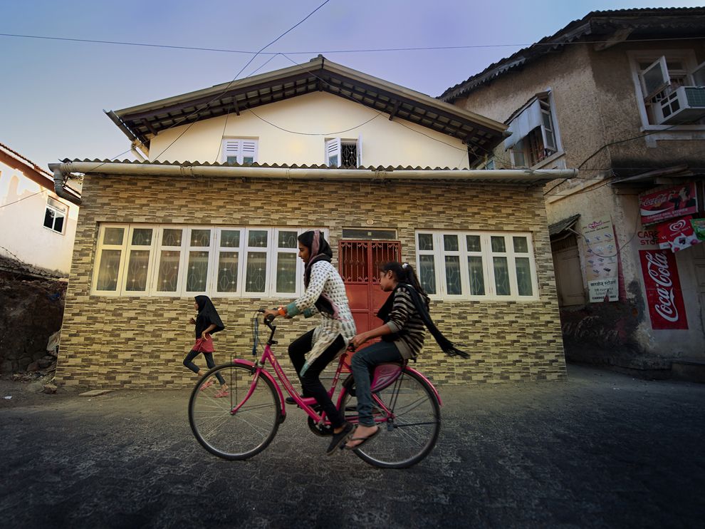 Picture of girls riding a bicycle in India